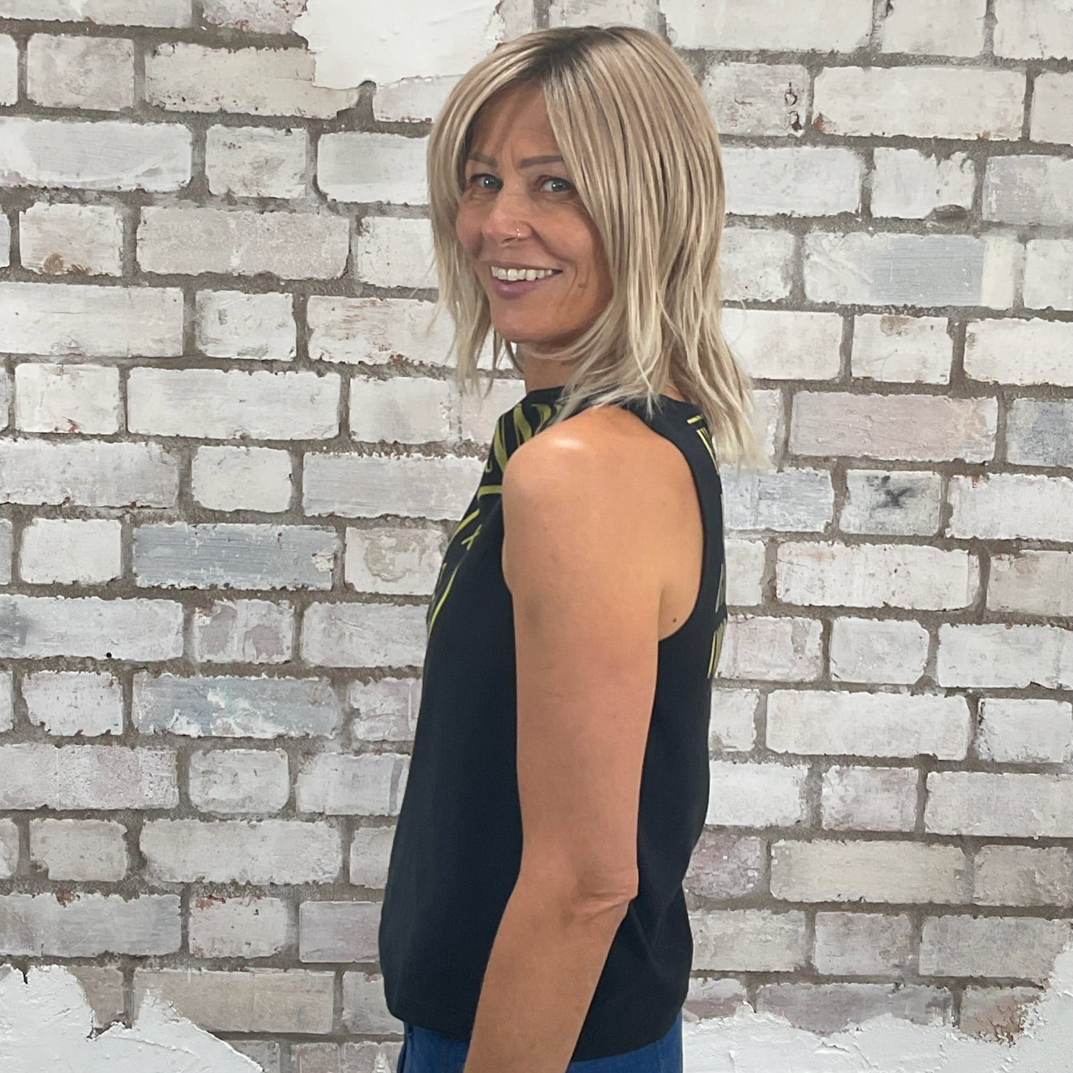 One-of-a-kind Nirvana Acid Face Yellow Print graphic Slash Neck Unwantee tank top side view, upcycled, sustainable, made in Britain