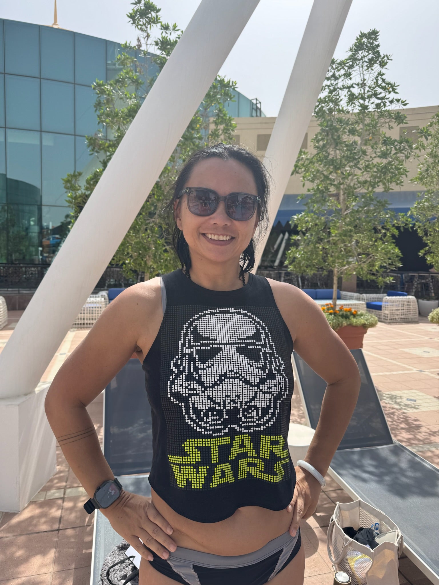 Woman smiling while wearing a Star Wars halftone graphic Unwantee tank top outdoors